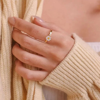 Anillo de margarita giratorio antitensión