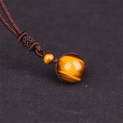 Colgante de Ojo de Tigre con Cordón Trenzado – Protección, Confianza y Equilibrio