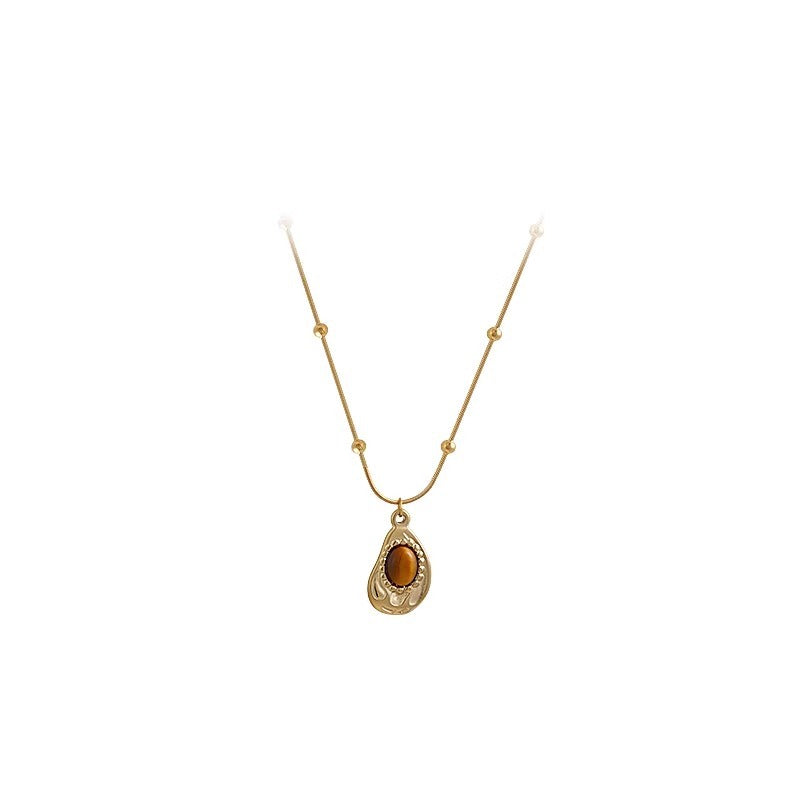 Collar de Ámbar y Ojo de Tigre: Energía, Elegancia y Protección en Tu Estilo
