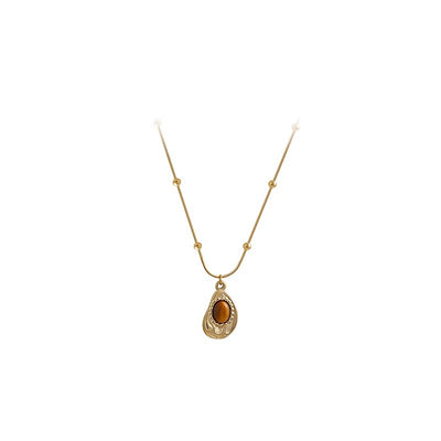 Collar de Ámbar y Ojo de Tigre: Energía, Elegancia y Protección en Tu Estilo
