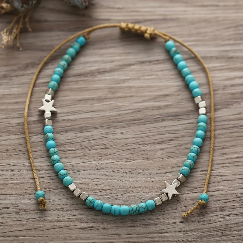 Tobillera de mujer con perla turquesa y estrella