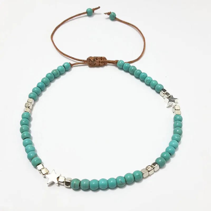 Tobillera de mujer con perla turquesa y estrella