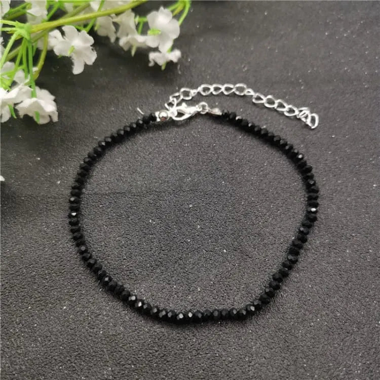 Tobillera de mujer con piedras negras de cristal