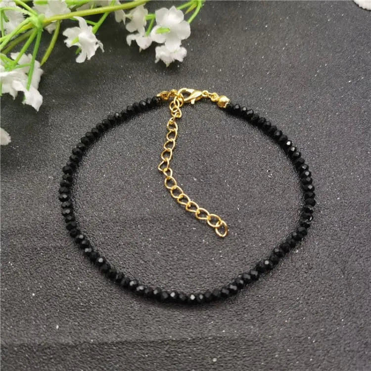 Tobillera de mujer con piedras negras de cristal