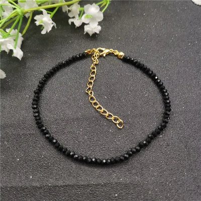 Tobillera de mujer con piedras negras de cristal