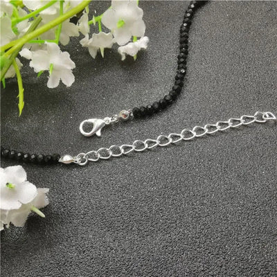 Tobillera de mujer con piedras negras de cristal
