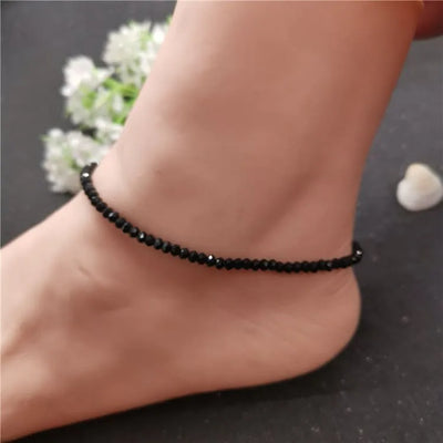 Tobillera de mujer con piedras negras de cristal