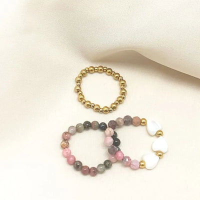 Trío de anillos de rodocrosita y perlas
