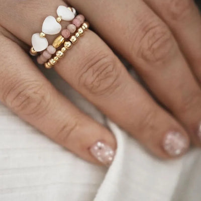 Trío de anillos de rodocrosita y perlas
